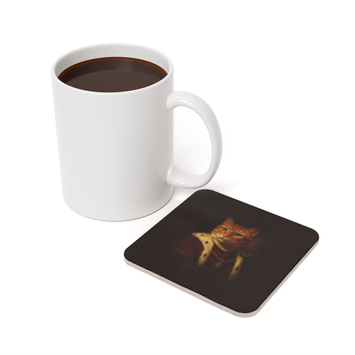 An orange cat as a royal noble portrait on the cork coaster, next to a coffee mug (mockup, example portrait — not a photo of a real print)